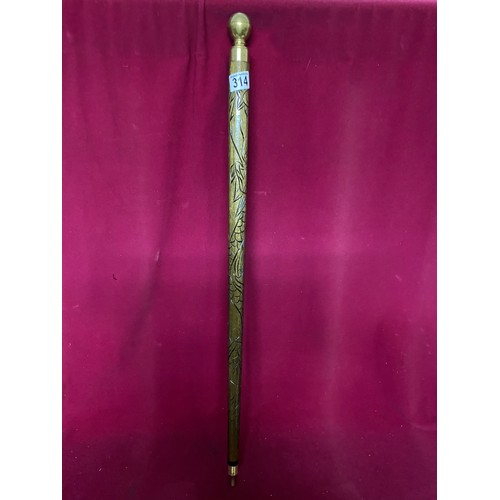 314 - Walking stick/snooker cue with brass handle and decorative carving.