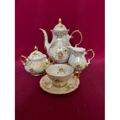 327 - Bavaria 22K gold tea set comprising 6 cups and saucers, milk and sugar bowl and teapot