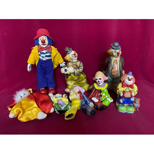 268 - Collection of 8 x clowns/jesters with largest measuring 23cms tall