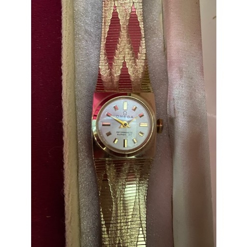 332 - Omega ladies watch with gold tone metal strap.