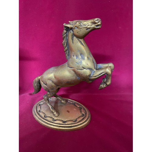 208 - 3 x pieces of vintage brassware, a dove, a dolphin and a prancing horse measuring 24 cms talll