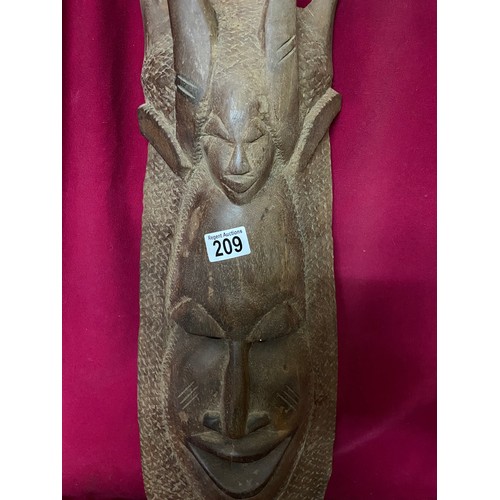 209 - Wooden african mask measuring 66 cms tall