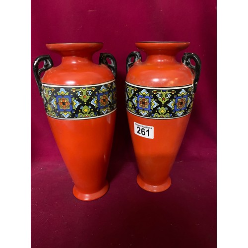 261 - Pair of red Rubian Art pottery vases standing 29 cms tall and a matching bowl standing 18 cms tall