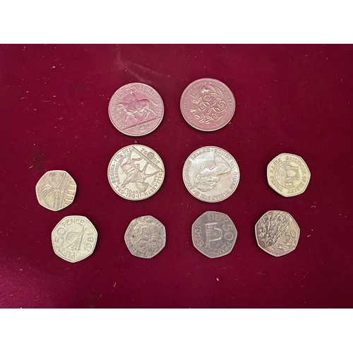 134 - Assortment of collectable 50p and £5 coins.