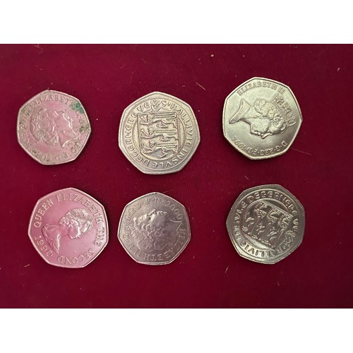 134 - Assortment of collectable 50p and £5 coins.