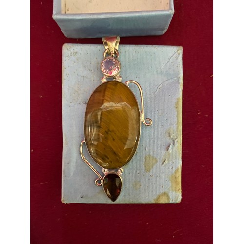 119 - Large Tigers eye pendant set in silver