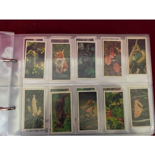 158 - Album of mint condition tea cards in complete sets in padded album, 12 sets in total.