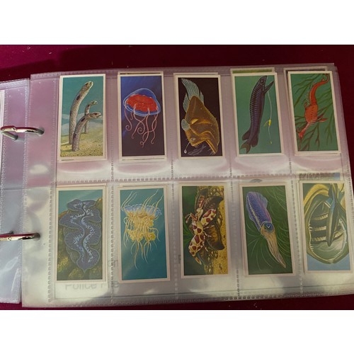 195 - Album of 14 complete sets of tea cards in mint condition.