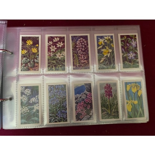 195 - Album of 14 complete sets of tea cards in mint condition.