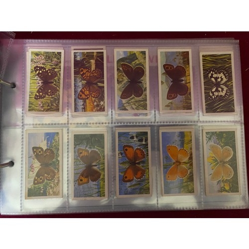 195 - Album of 14 complete sets of tea cards in mint condition.