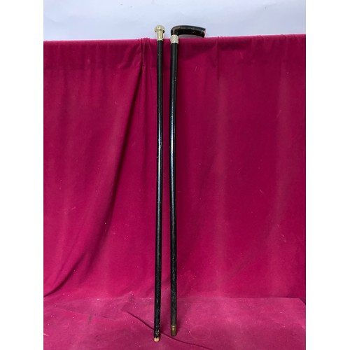 621 - Antique silver collared walking stick and silver topped walking cane