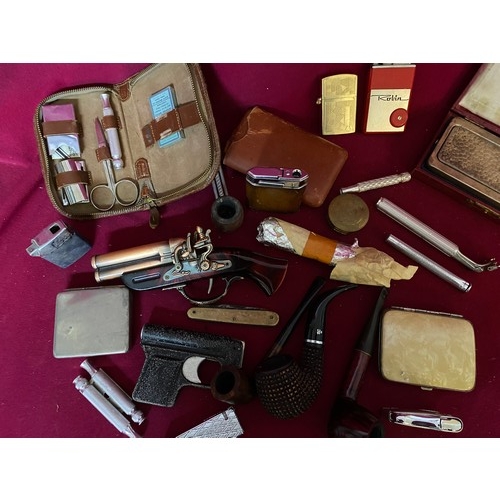 492 - Collection of smoking memorabilia, lighters, pipes and cigarette cases.