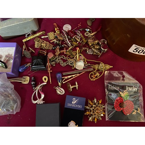 506 - Box of vintage costume jewellery comprising of cufflinks, brooches and bracelets.