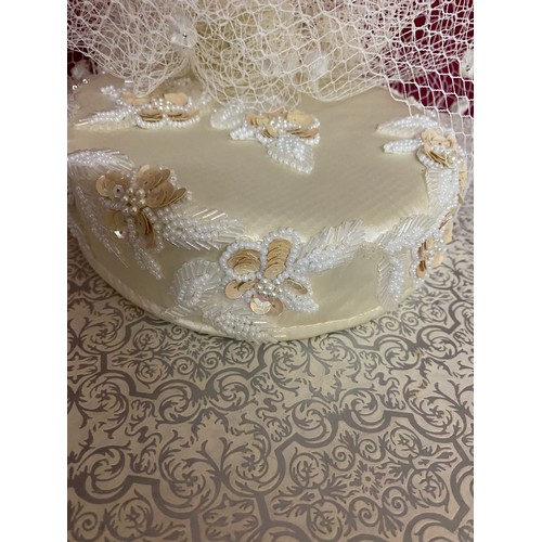 103 - Hat box with handles complete with sequinned Pill Box hat in cream with net trim. Excellent conditio... 