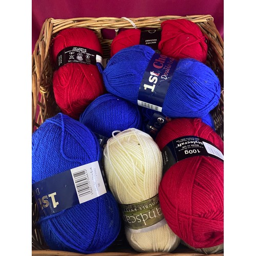 132 - Assortment of 15 x 100g balls of wool of assorted makes in red, white and blue in wicker basket