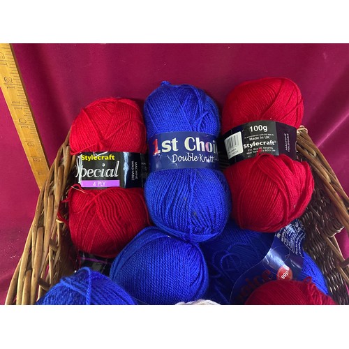 132 - Assortment of 15 x 100g balls of wool of assorted makes in red, white and blue in wicker basket