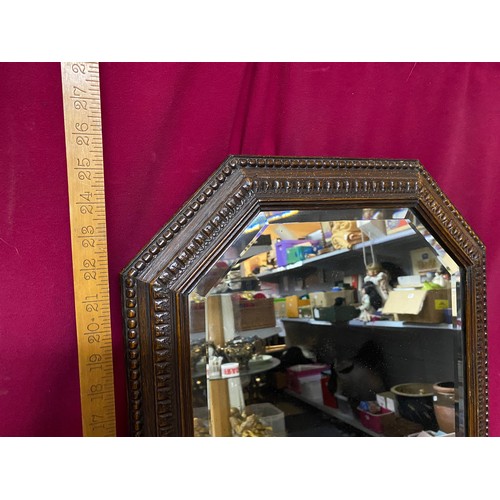 214 - Antique solid Oak framed bevelled mirror.