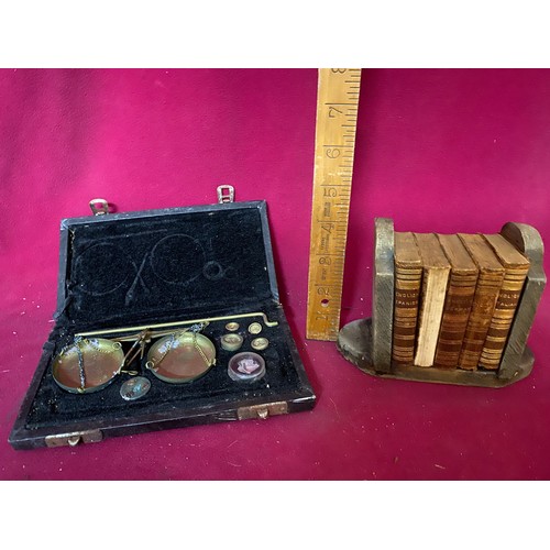 223 - Complete Antique brass miniature weighing scales and Antique miniature leather bound dictionaries on... 