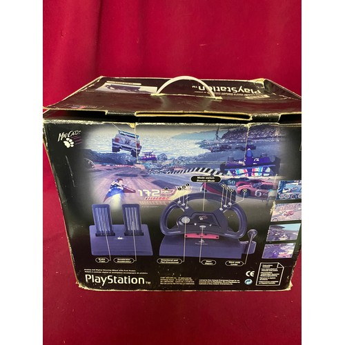 237 - Playstation Madcatz boxed steering wheel and foot pedal.