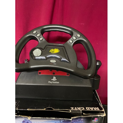 237 - Playstation Madcatz boxed steering wheel and foot pedal.