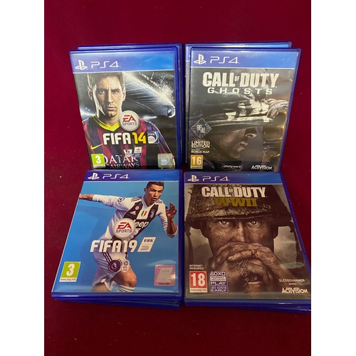 268 - Box with PS4 controller, gaming headsetstand and selection of PS4 games.