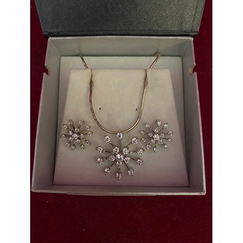 278 - Sterling silver and Crystal snowflake necklace and ear-ring set.