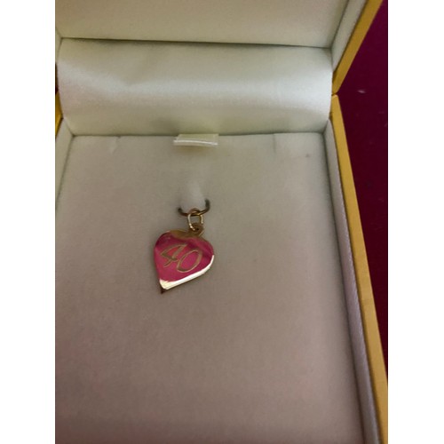 279 - Boxed 9ct gold heart charm 0.8g