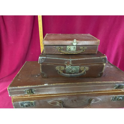 307 - Selection of 3 1950's style brown suitcases