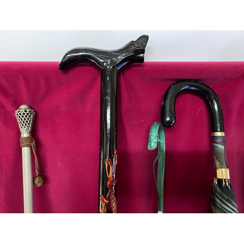 372 - Collection of vintage walking sticks and umbrellas.