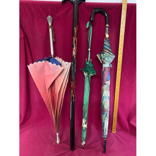 372 - Collection of vintage walking sticks and umbrellas.