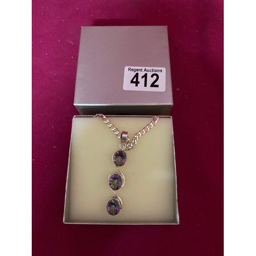 412 - Stone set pendant and chain marked 925 silver in presentation box.