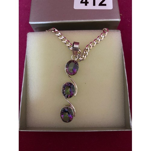 412 - Stone set pendant and chain marked 925 silver in presentation box.