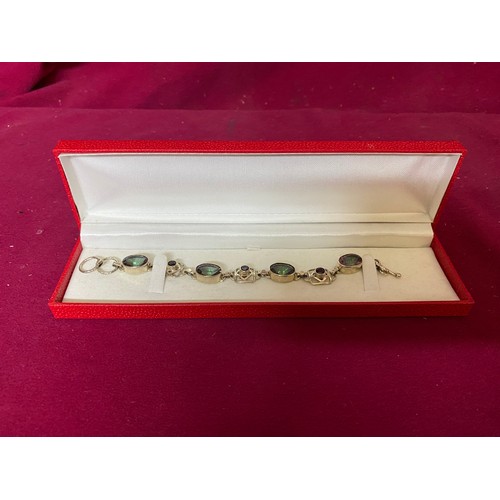 413 - Stone set bracelet marked 925 silver and in presentation box.