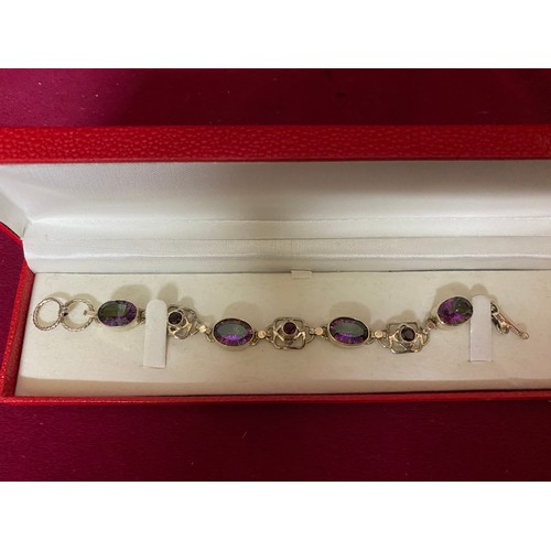 413 - Stone set bracelet marked 925 silver and in presentation box.