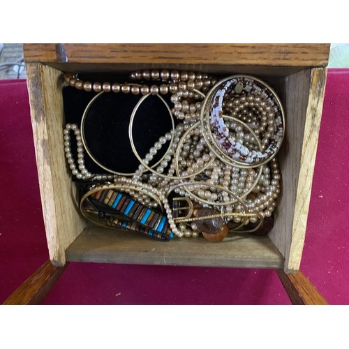 258 - Vintage wooden drawers filled with costume jewellery.