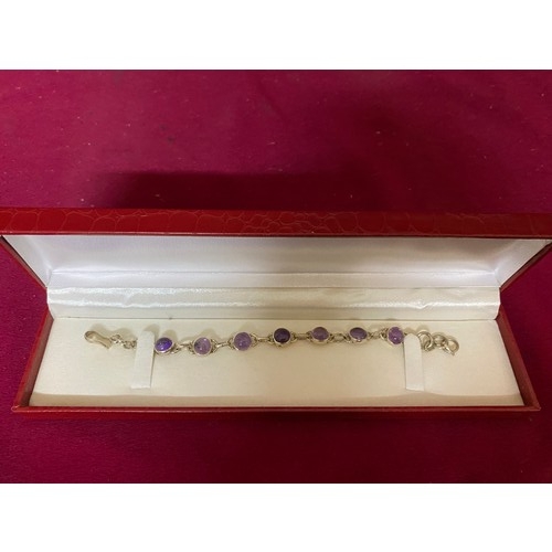 414 - Stone set bracelet marked 925 silver and in presentation box.