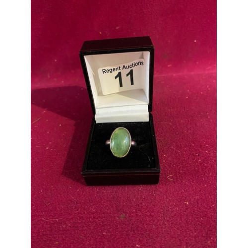 11 - Sterling silver ring set with green stone.