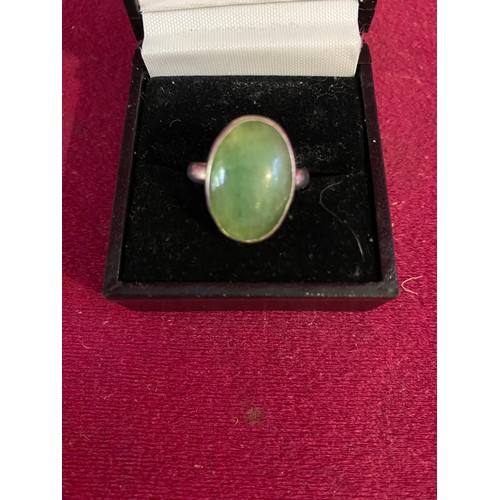 11 - Sterling silver ring set with green stone.