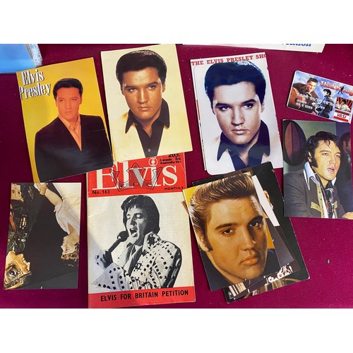 31 - Collection of Elvis memorabilia including lighters, belt buckle, badges and ephemera.