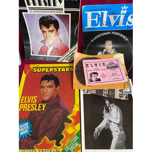 31 - Collection of Elvis memorabilia including lighters, belt buckle, badges and ephemera.