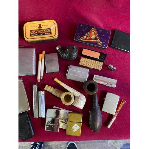 46 - Assortment of smoking items including Lighters, Pipes and others.