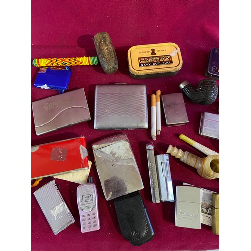 46 - Assortment of smoking items including Lighters, Pipes and others.