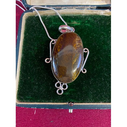 76 - Large Tigers Eye pendant set in sterling silver on sterling silver chain.