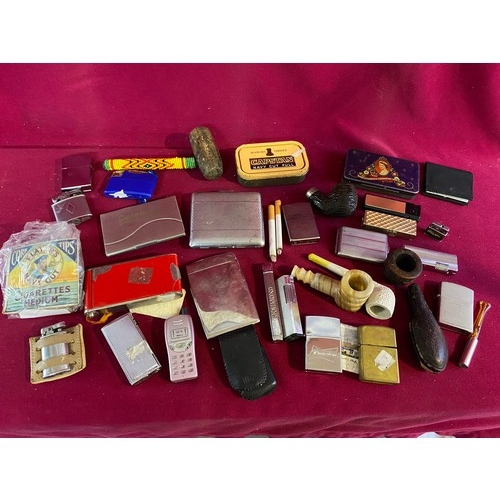 46 - Assortment of smoking items including Lighters, Pipes and others.