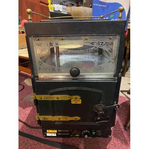 445 - Retro potato oven with tile top and brass fittings.