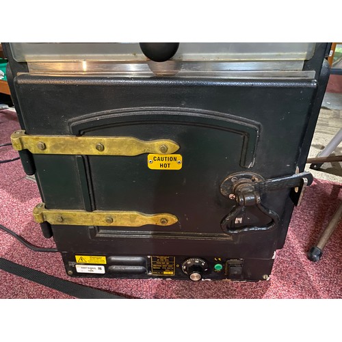 445 - Retro potato oven with tile top and brass fittings.