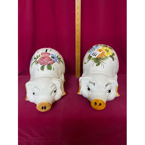 454 - 2 large pottery pig money boxes.