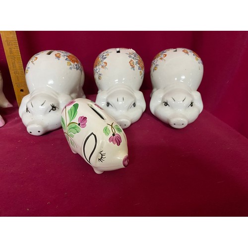 455 - 7 pottery pig money boxes and small decorative pig teapot.