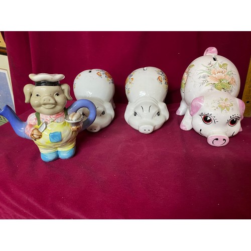 455 - 7 pottery pig money boxes and small decorative pig teapot.