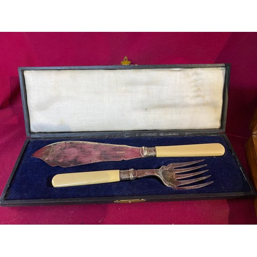 562 - Collection of boxed cutlery including fish knife set with silver bands